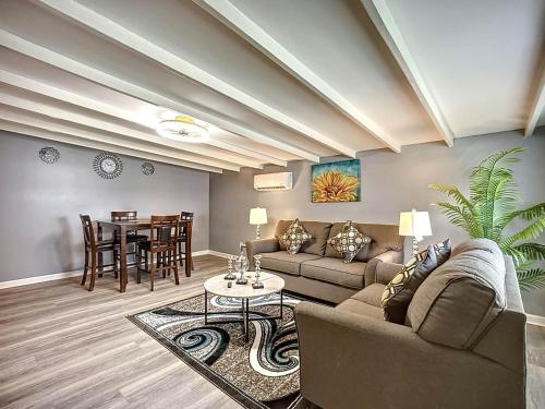 a living room with a couch and a table at Private Guest House 10 Min to Airport & Downtown in Jacksonville