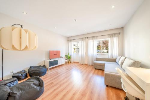 a living room with a couch and a table at GuestReady - Retreat in Almada in Almada