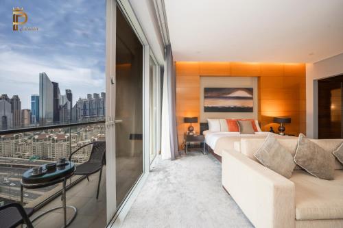 a bedroom with a bed and a view of a city at Paradise View The Dubai Mall Residences in Dubai