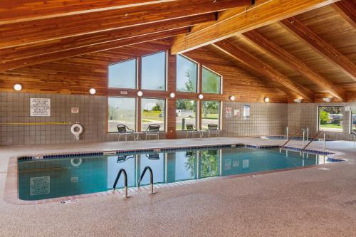 a large swimming pool in a building with windows at MountainView Lodge and Suites in Bozeman