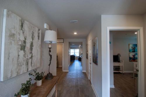 a hallway of a home with a living room at Off the Grid in Foley