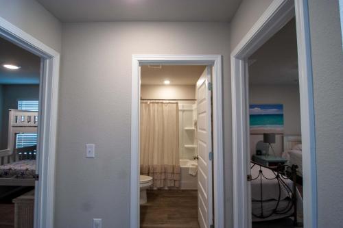 a bathroom with a sink and a toilet in a room at Off the Grid in Foley