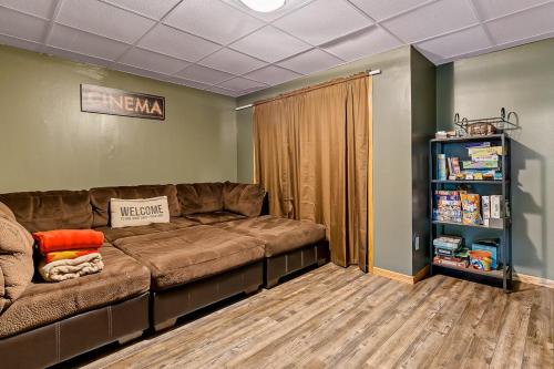 a living room with a couch and a book shelf at Happy Jack in Rapid City
