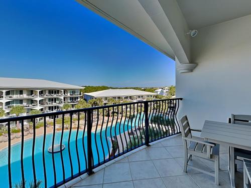 a balcony with a view of the pool and beach at Adagio #402D in Santa Rosa Beach
