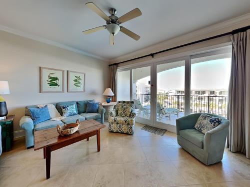 a living room with a couch and a table at Adagio #402D in Santa Rosa Beach