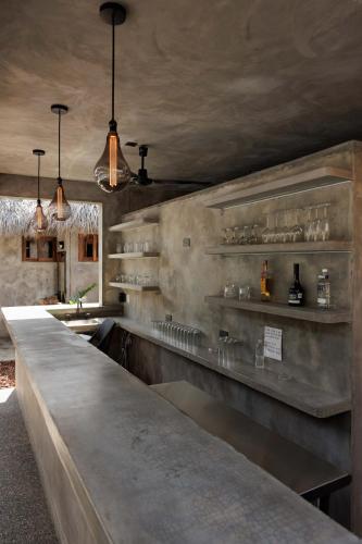 a kitchen with a long counter in a room at Hotel Boutique Pikiliki - ADULTS ONLY in Brisas de Zicatela