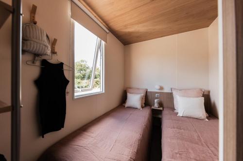 Llit o llits en una habitació de Camping OAKi