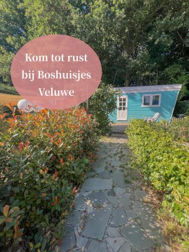 a sign in front of a tiny house with a sign that readsoir not just at Uniek boshuisje Olijfje met omheinde tuin op loopafstand Veluwse bos in Putten