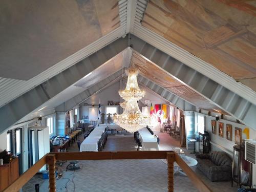 an overhead view of a living room with a chandelier at Borgahallen The Wedding Room in Rimbo