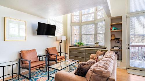 a living room with a couch and two chairs at Columbia Place 5 by AvantStay Ski-InSki-Out Unit in Great Location in Telluride