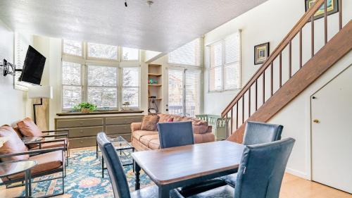 a living room with a table and chairs at Columbia Place 5 by AvantStay Ski-InSki-Out Unit in Great Location in Telluride