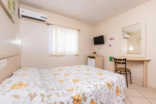 En eller flere senge i et værelse på Hotel Express Canoas