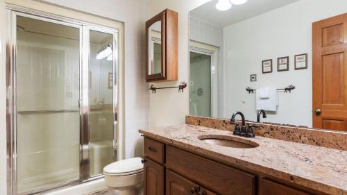 a bathroom with a sink and a shower and a toilet at Riverside Condos B101 by AvantStay Condo Close To Downtown Town Park Ski Lift 8 in Telluride