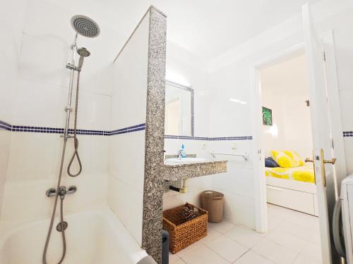 a bathroom with a shower and a sink at El Pisito Dulce Vista in Tías