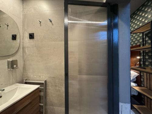 a bathroom with a shower and a sink at Kiosk 550 Apartment - Póvoa de Varzim in Póvoa de Varzim