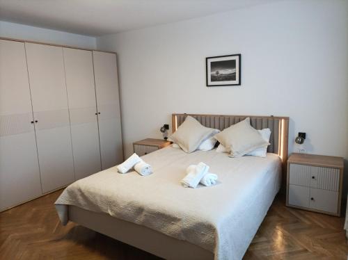 a bedroom with a bed with towels on it at Casa Mia 2 in Punat