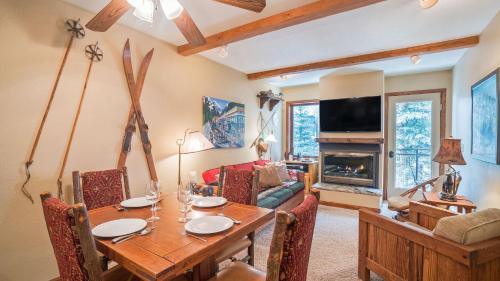 a dining room with a table and a couch at Ghostriders 5 by AvantStay 2 Bedroom Condo Near Main Street Hiking Skiing STR permit 3571 in Telluride