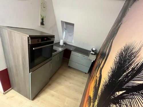 a kitchen with a stove and a counter top at ANCiENT CiTY WALL in Nuremberg