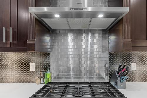 a kitchen with a stove top oven in a kitchen at Hearthside Estate in Prince George