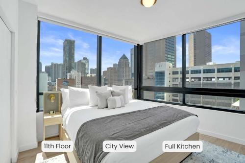 a bedroom with a large bed with a city view at Miami Condo 2BR Rooftop Pool & Gym in Miami