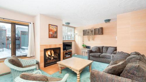 a living room with a couch and a fireplace at Telluride Lodge 312 by AvantStay Close to Slopes Town in Telluride