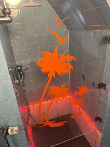 a sticker of a palm tree on the wall of a bathroom at ANCiENT CiTY WALL in Nuremberg