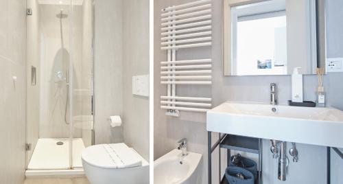 a white bathroom with a toilet and a sink at Casa Contra in La Spezia