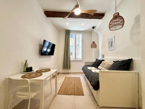 a living room with a couch and a table at Casa Sauge in Grasse