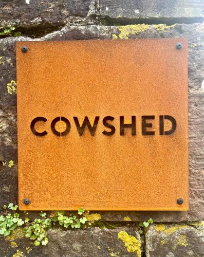 a sign on a wall with the word conveyed at The Old Cowshed - B and B in Pembroke