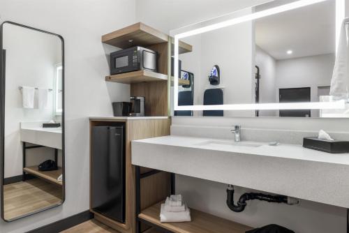 a bathroom with a sink and a microwave at Best Western San Diego Pacific Beach/Mission Bay in San Diego