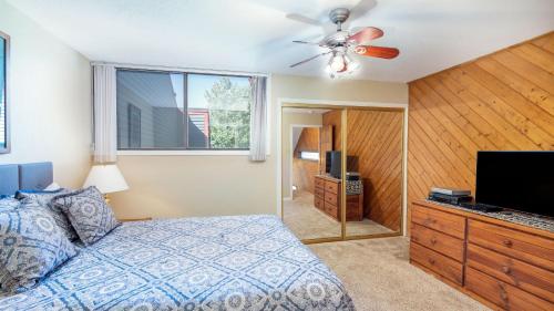 a bedroom with a bed and a flat screen tv at Telluride Lodge 405 by AvantStay Close to Slopes Town in Telluride