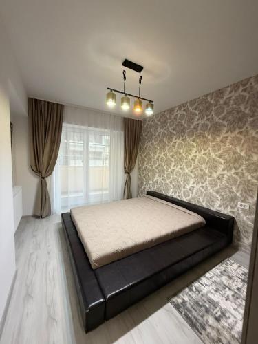 a bedroom with a large bed in a room at The Urban Hide by D'or Selection in Bucharest