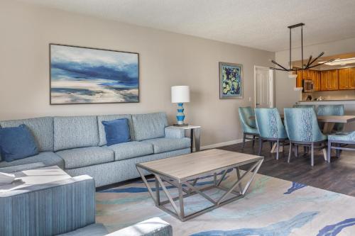 a living room with a couch and a table at Hilton Grand Vacations Club SeaWorld Orlando in Orlando