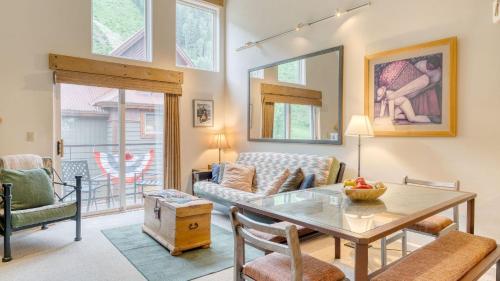 a living room with a table and a couch at Double Diamond 23 by AvantStay Close to Town The Slopes in Telluride