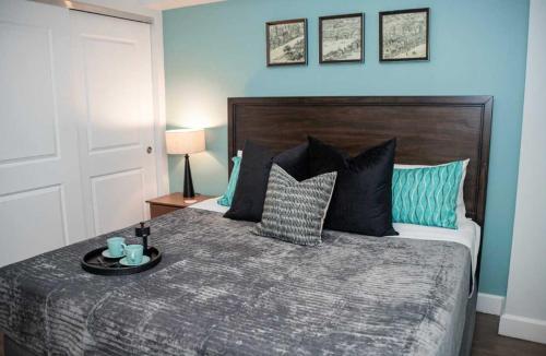 a bedroom with a bed with a tray on it at Fun Cozy 1 Br King Apts - 1 25 Mile Walk to TIAA Bnk Fld in Jacksonville