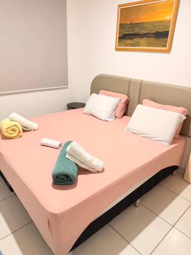 a hospital room with two beds with towels on them at RESIDENCIAL SOPHIA in Eunápolis