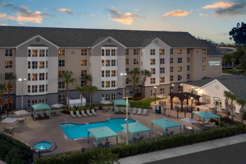 an aerial view of a hotel with a pool at Homewood Suites by Hilton Orlando-Nearest to Universal Studios in Orlando