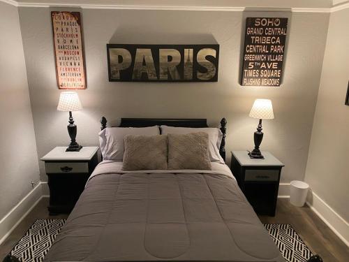 a bedroom with a large bed with two night stands at Classic California Bungalow Downtown in Bakersfield
