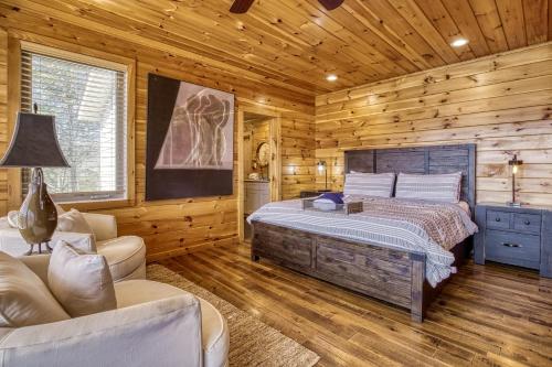 a bedroom with a bed in a wooden cabin at Leconte Mountain Lodge in Sevierville