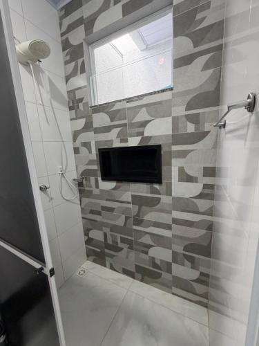 a bathroom with a shower with a glass door at VivaVida Bounganvilli 02 in Sinop