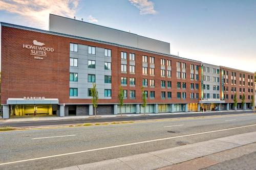 a large brick building on the side of a street at Homewood Suites by Hilton Boston Brookline-Longwood Medical in Brookline
