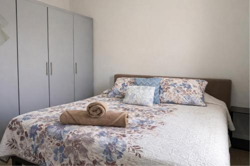 a bed with a towel sitting on top of it at Casa Nobleza in Manuel F. Martínez