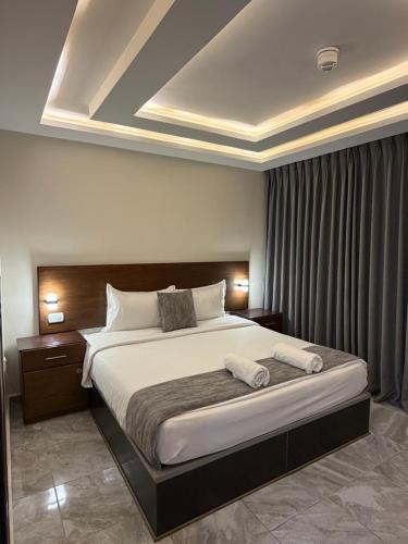 Postel nebo postele na pokoji v ubytování TAJ Hotel