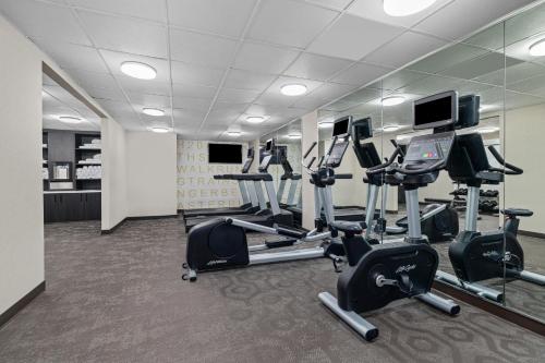 a gym with several treadmills and exercise bikes at Residence Inn Paducah in Paducah
