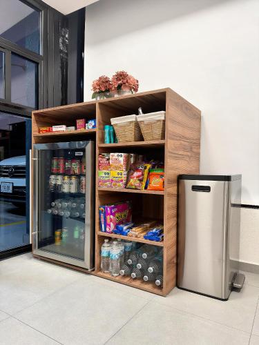 a refrigerator in a kitchen next to a counter at Hotel Nuevo Vallarta in Guadalajara