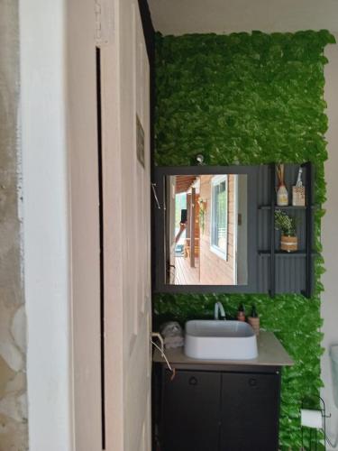 a bathroom with a sink and a mirror at Recanto do sol in Imaruí