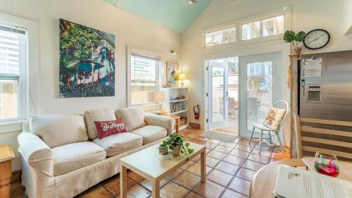 a living room with a couch and a table at Casita de Catherine by AvantStay 1 Block to Duval St w Hot Tub in Key West