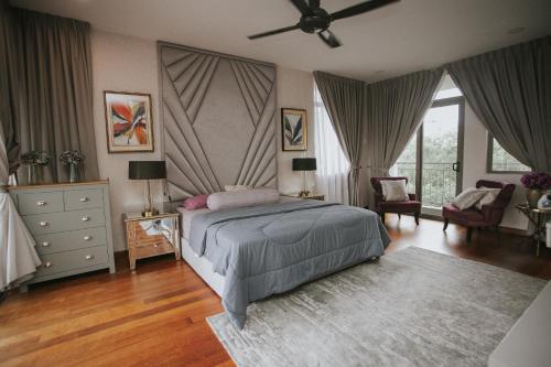 a bedroom with a bed and a ceiling fan at Pearly 16 in Putrajaya