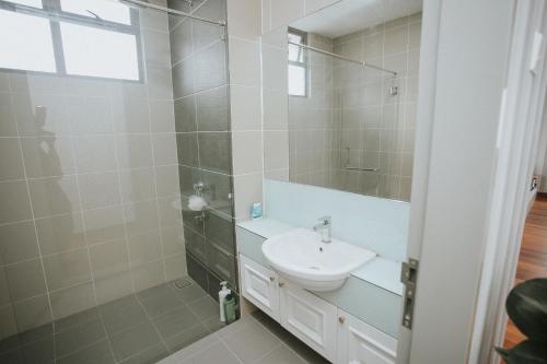 a bathroom with a sink and a mirror at Pearly 16 in Putrajaya