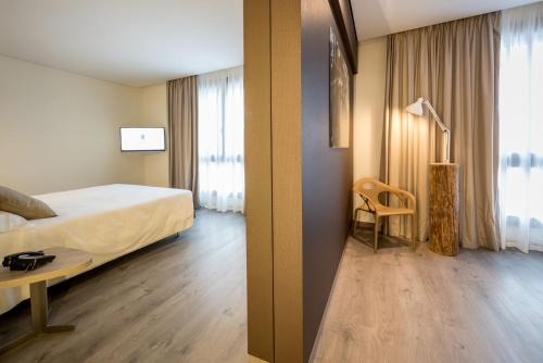 Ένα ή περισσότερα κρεβάτια σε δωμάτιο στο Fuori le Mura